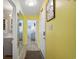Bright hallway with mirror and view into bedroom and bathroom at 600 S Ocean Blvd. # C-21, North Myrtle Beach, SC 29582