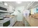 Efficient kitchen with white appliances and light countertops at 600 S Ocean Blvd. # C-21, North Myrtle Beach, SC 29582
