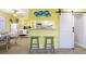 Kitchen with breakfast bar and a view into the living area at 600 S Ocean Blvd. # C-21, North Myrtle Beach, SC 29582