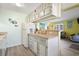 Kitchen with white cabinets, granite counters, and beachy decor at 600 S Ocean Blvd. # C-21, North Myrtle Beach, SC 29582
