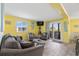 Bright living room with comfy seating, access to balcony, and coastal decor at 600 S Ocean Blvd. # C-21, North Myrtle Beach, SC 29582