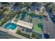 Aerial view shows resort-style amenities including pool and tennis court at 601 Mitchell Dr. # 1002, Myrtle Beach, SC 29577