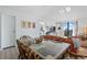 Dining area with glass-top table and wicker chairs at 601 Mitchell Dr. # 1002, Myrtle Beach, SC 29577
