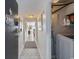 Bright hallway with tile floors, laundry closet, and access to living space at 601 Mitchell Dr. # 1002, Myrtle Beach, SC 29577
