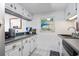 Bright kitchen features stainless steel appliances and white cabinets at 601 Mitchell Dr. # 1002, Myrtle Beach, SC 29577