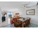 Living room with dining area, sofa, and balcony access at 601 Mitchell Dr. # 1002, Myrtle Beach, SC 29577