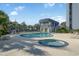 Community pool and hot tub with lounge chairs at 601 Mitchell Dr. # 1002, Myrtle Beach, SC 29577