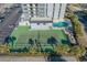 Community tennis court with surrounding landscaping at 601 Mitchell Dr. # 1002, Myrtle Beach, SC 29577
