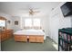 King bedroom with two windows, ceiling fan, dresser, and bookshelf at 6095 Catalina Dr. # 2611, North Myrtle Beach, SC 29582