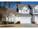 Two story townhome with white siding, gray roof, and attached garage at 6095 Catalina Dr. # 2611, North Myrtle Beach, SC 29582