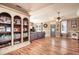 Spacious living room featuring hardwood floors and built-in shelving at 616 West Virginia Rd., Georgetown, SC 29440