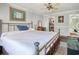 Main bedroom with a large bed, closet, and bathroom access at 7601 North Ocean Blvd. # 1B, Myrtle Beach, SC 29572