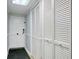 Bright hallway with white doors and built-in storage at 7601 North Ocean Blvd. # 1B, Myrtle Beach, SC 29572