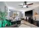 Living room with large TV, fireplace, and access to patio at 7601 North Ocean Blvd. # 1B, Myrtle Beach, SC 29572