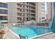 Inviting pool area with ample lounge chairs and tables at 7601 North Ocean Blvd. # 1B, Myrtle Beach, SC 29572