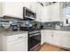 Stainless steel appliances and granite countertops in this updated kitchen at 839 Rosa Circle, Myrtle Beach, SC 29577