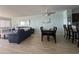 Open concept living and dining area with a dark wood table at 1000 N Waccamaw Dr. # 302, Murrells Inlet, SC 29576