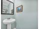 Simple pedestal sink in light teal bathroom at 104 Grace Bay Ct., Pawleys Island, SC 29585