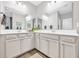 Double vanity bathroom with gray cabinets and a large mirror at 104 Grace Bay Ct., Pawleys Island, SC 29585