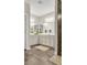 Double vanity bathroom with light beige cabinets at 104 Grace Bay Ct., Pawleys Island, SC 29585