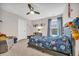 Colorful bedroom featuring a playful outer-space theme, a ceiling fan, and lots of room at 104 Grace Bay Ct., Pawleys Island, SC 29585