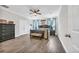 Spacious bedroom with a dark wood bed frame and ensuite bathroom at 104 Grace Bay Ct., Pawleys Island, SC 29585