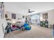 Spacious carpeted bedroom with a ceiling fan, bed and playful decor at 104 Grace Bay Ct., Pawleys Island, SC 29585