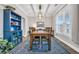 Elegant dining room with stylish lighting, large windows, and a spacious layout at 104 Grace Bay Ct., Pawleys Island, SC 29585