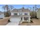 Charming two-story home with a well-maintained front yard and attached garage at 104 Grace Bay Ct., Pawleys Island, SC 29585