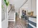 Bright foyer featuring a staircase, hardwood floors, and elegant decor at 104 Grace Bay Ct., Pawleys Island, SC 29585