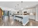 Open-concept kitchen with a large island, pendant lighting, and seating for four at 104 Grace Bay Ct., Pawleys Island, SC 29585