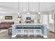 Modern kitchen featuring an island with seating, sleek countertops, and stainless appliances at 104 Grace Bay Ct., Pawleys Island, SC 29585