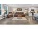 Cozy living room featuring hardwood floors, leather furniture, and lots of natural light at 104 Grace Bay Ct., Pawleys Island, SC 29585