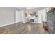 View of a living area with hardwood floors, a fireplace, and doorways to other rooms at 104 Grace Bay Ct., Pawleys Island, SC 29585