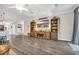 Spacious living area with wood floors, a ceiling fan, and a decorative entertainment center at 104 Grace Bay Ct., Pawleys Island, SC 29585