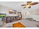 Spacious living room featuring an entertainment center, a ceiling fan, and plenty of natural light at 104 Grace Bay Ct., Pawleys Island, SC 29585