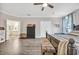 Bright bedroom showcasing hardwood floors, ceiling fan, and private bathroom entrance at 104 Grace Bay Ct., Pawleys Island, SC 29585