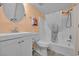 Well-lit bathroom featuring a shower-tub combo with stylish shower curtain at 1100 Possum Trot Rd. # E-238, North Myrtle Beach, SC 29582