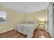 Bedroom featuring bright natural light, hardwood floors, and neutral décor at 1100 Possum Trot Rd. # E-238, North Myrtle Beach, SC 29582