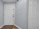 Clean, bright condo entryway featuring new flooring, white door, and a coat closet at 1100 Possum Trot Rd. # E-238, North Myrtle Beach, SC 29582