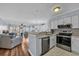 Open kitchen featuring stainless appliances and easy access to the living room at 1100 Possum Trot Rd. # E-238, North Myrtle Beach, SC 29582