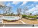 Inviting community pool with white picket fence, landscaped yard and clear skies at 1100 Possum Trot Rd. # E-238, North Myrtle Beach, SC 29582