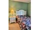 Bedroom with double bed and floral bedding at 121 Marshland Ct., Myrtle Beach, SC 29572