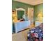 Bright bedroom with floral bedding and white dresser at 121 Marshland Ct., Myrtle Beach, SC 29572