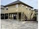 Elevated beach house with deck and stairs at 121 Marshland Ct., Myrtle Beach, SC 29572
