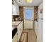 Galley kitchen with white cabinets and appliances at 121 Marshland Ct., Myrtle Beach, SC 29572