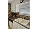 Bright kitchen features double sink, dishwasher, and ample counter space at 121 Marshland Ct., Myrtle Beach, SC 29572