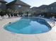 Community pool with surrounding patio furniture at 121 Marshland Ct., Myrtle Beach, SC 29572