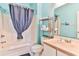 Bathroom with light blue walls, tub, and shower at 1302 River Oaks Dr. # 4-F, Myrtle Beach, SC 29579