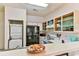 Kitchen with stackable washer/dryer and breakfast bar at 1302 River Oaks Dr. # 4-F, Myrtle Beach, SC 29579